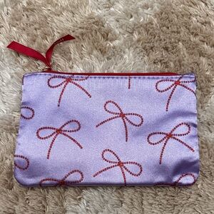 Purple Pouch with Red Bow Design